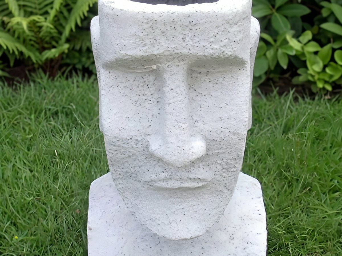 Easter Island garden planter in granite finish with trailing plants