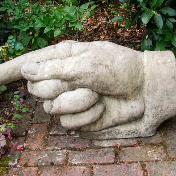 Pointing Hand Stone Statue