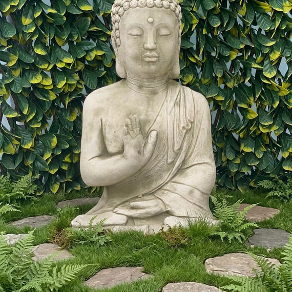 Buddha Prince Garden Ornament in a Zen Garden Setting with Ferns and Stepping Stones