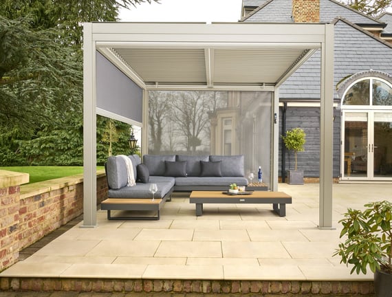 Nexus Beige Aluminium Pergola - Front Screen Down by House