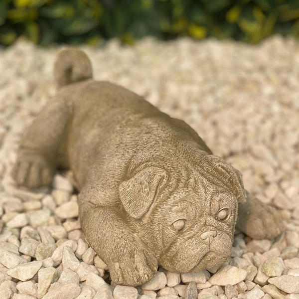 Sleeping Puppy Garden Ornament in Stone in a peaceful resting pose