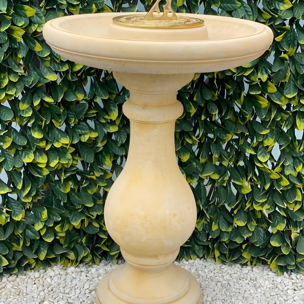 Fosse Sundial in Sandstone with a brass sundial plate above a shallow bowl