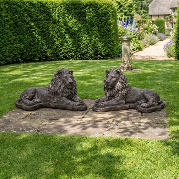 Pair of Chatsworth lion statues framing the entrance to a garden zone