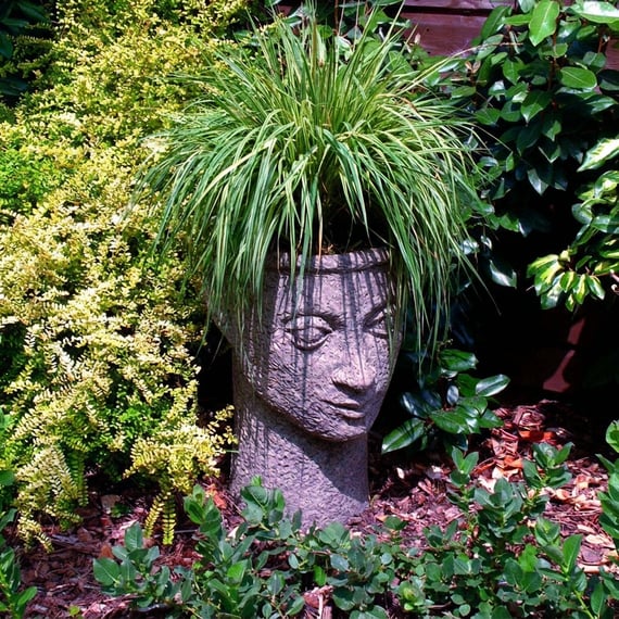 Gaia head vase, a classical stone head planter for a Mediterranean garden