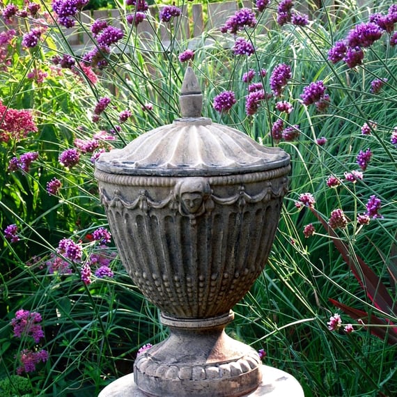 Olympic stone garden urn with lid in a formal UK garden