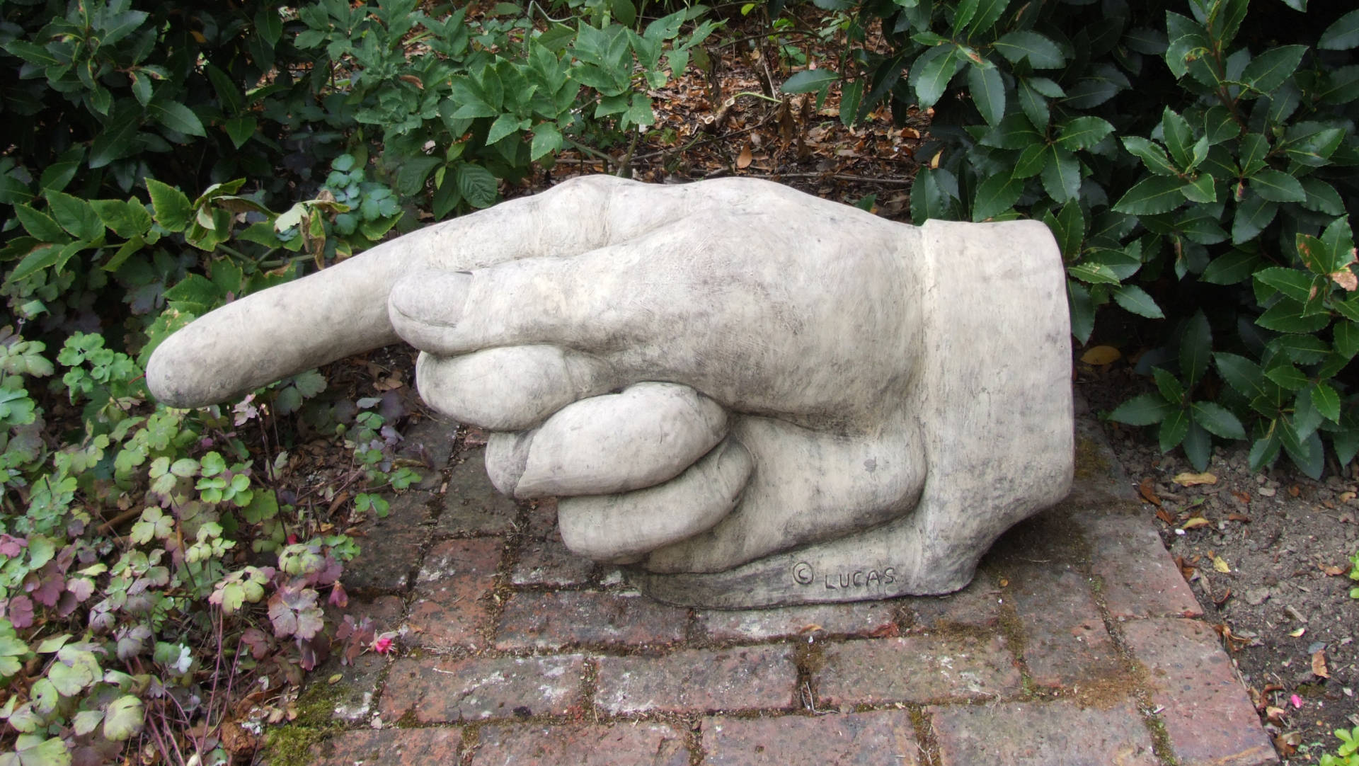 Pointing Hand Stone Statue